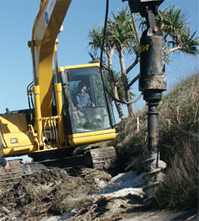 Excavator with auger